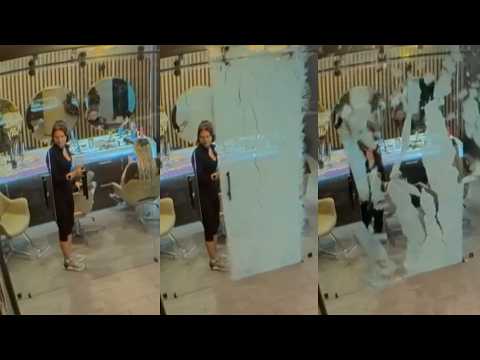 Glass Door Spontaneously Shatters On Woman